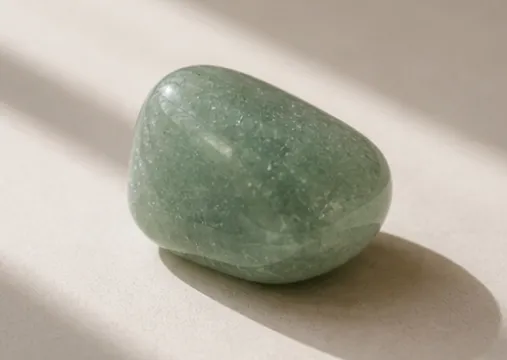 Tumbled green aventurine pebble in soft green